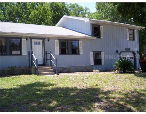 56443 Branch Road Astor, FL 32102 - Photo 1 of 1 a front view of a house with a yard