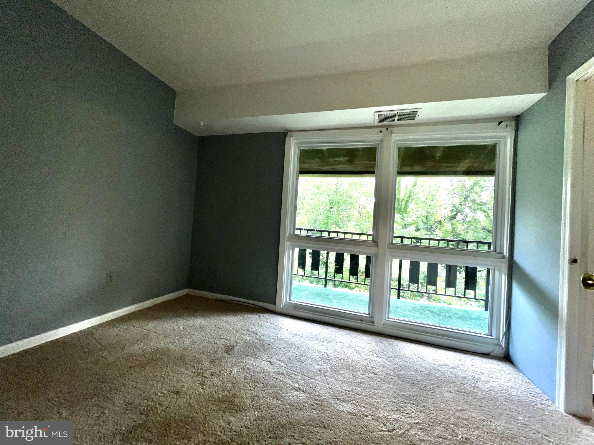 3138 Brinkley Road, Unit 8303 Temple Hills, MD 20748 - Photo 16 of 18 a view of an empty room with a window