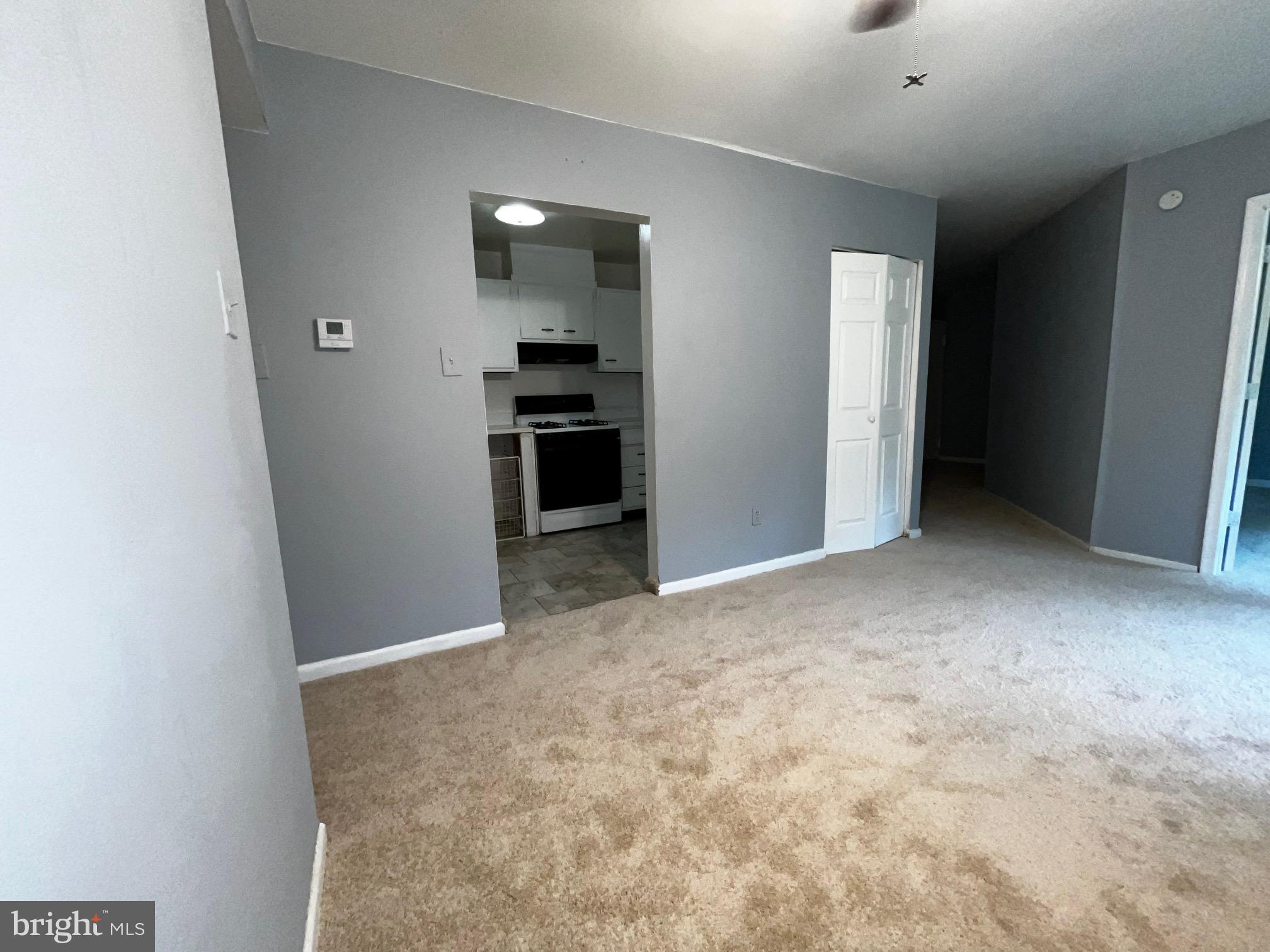3138 Brinkley Road, Unit 8303 Temple Hills, MD 20748 - Photo 6 of 18 an empty room with closet and windows