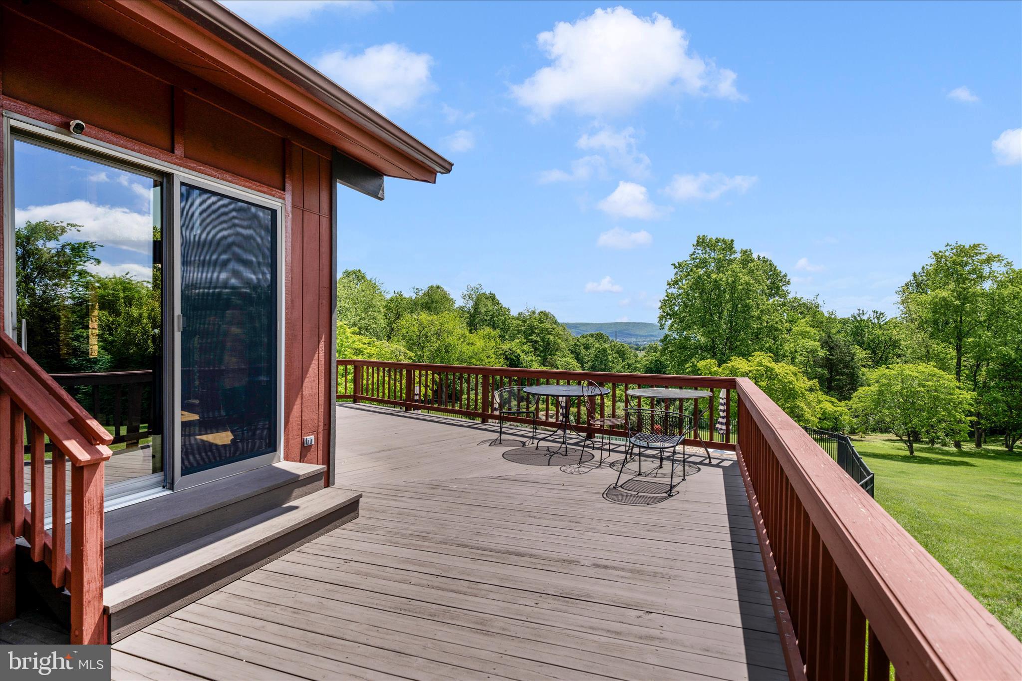 9237 Frostown Road Middletown, MD 21769 - Photo 91 of 113 a view of balcony with wooden floor and outdoor seating