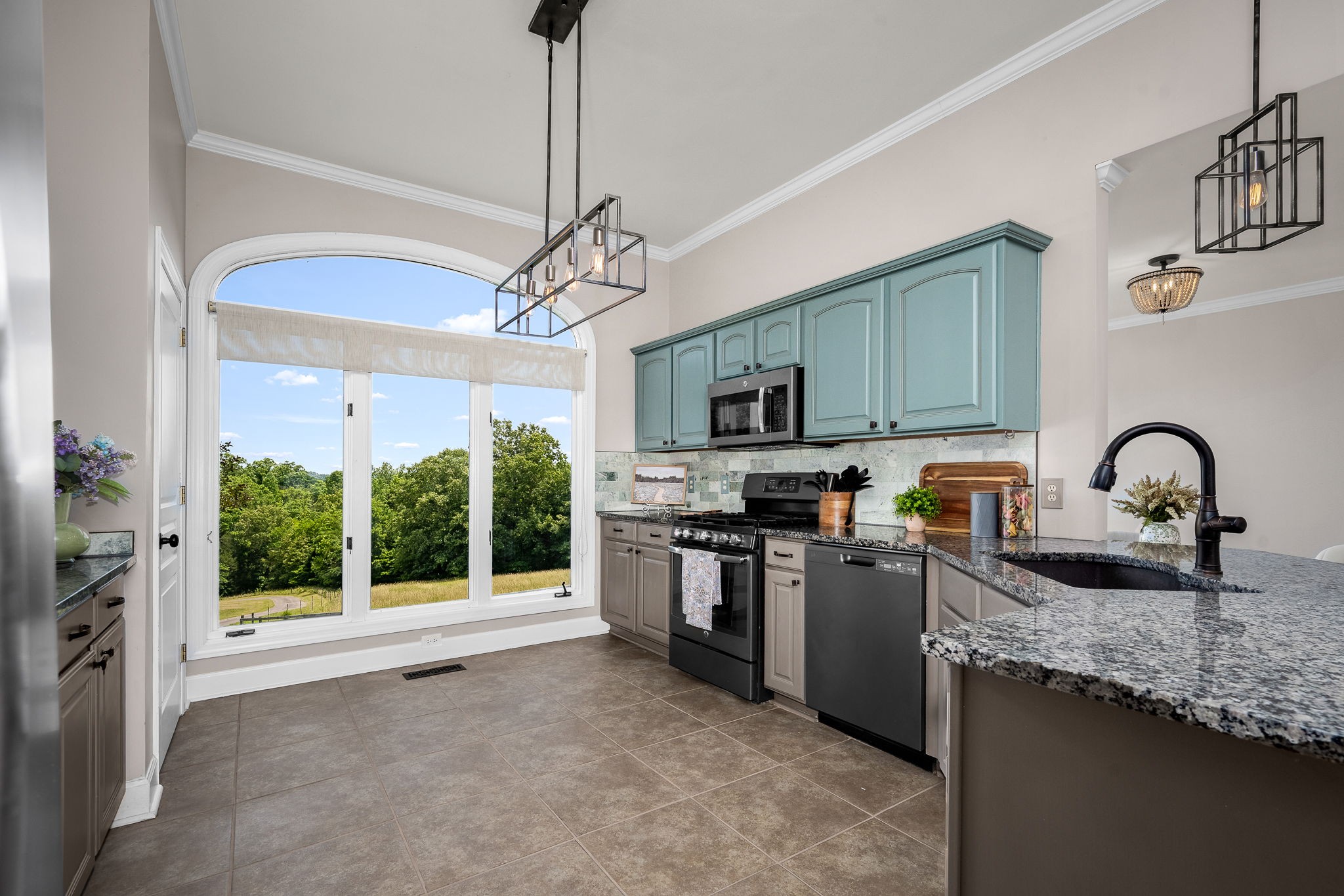 250 Home Pl Road Dickson, TN 37055 - Photo 27 of 62 a kitchen with stainless steel appliances granite countertop a stove top oven a sink a counter space and cabinets