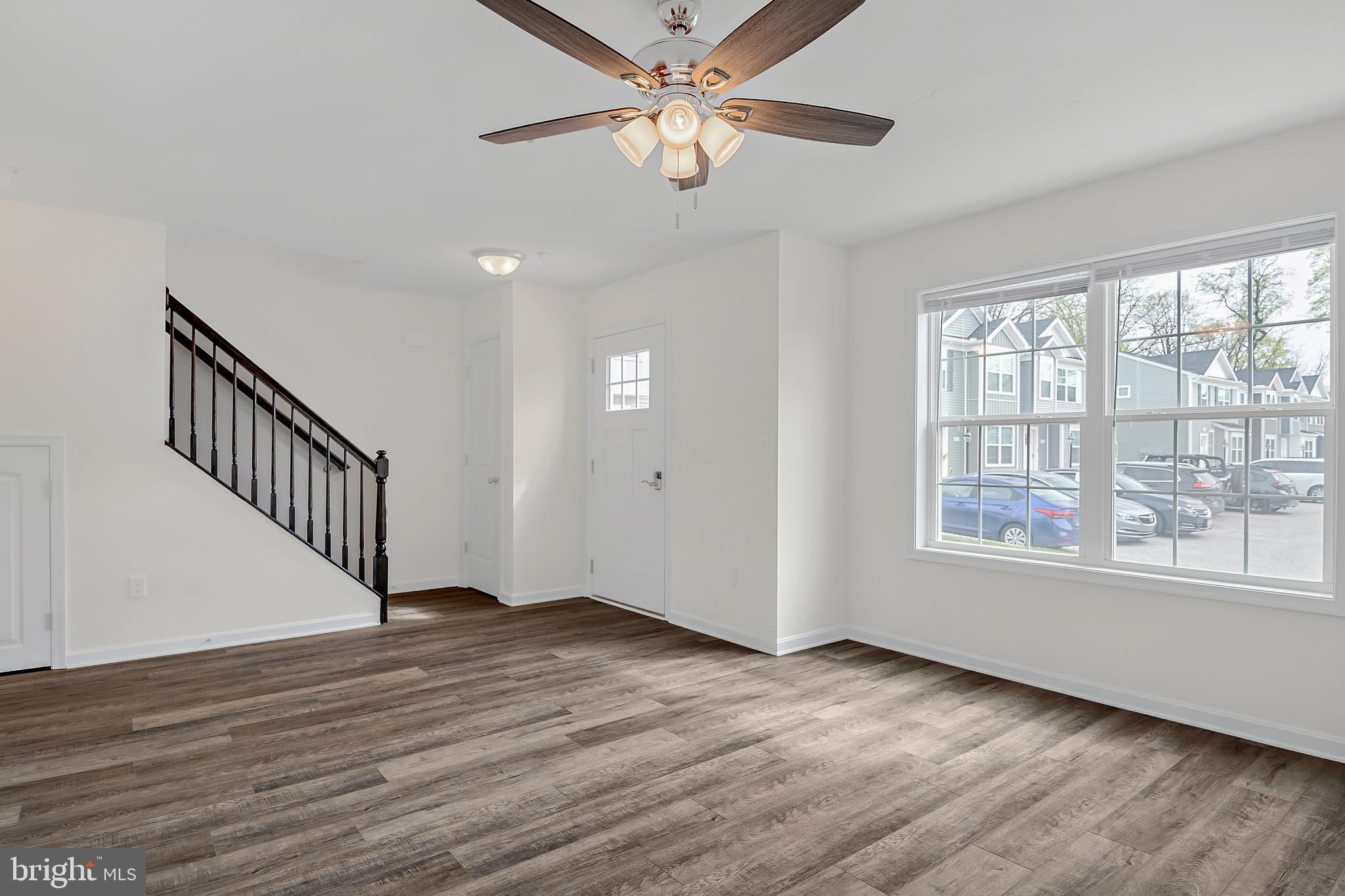 400 Valor Way Red Lion, PA 17356 - Photo 3 of 22 a view of an empty room with wooden floor and a window