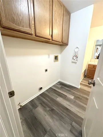 a view of a livingroom with wooden floor