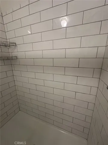 a view of a street with a garden