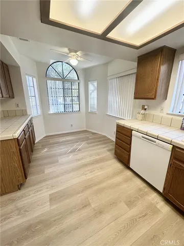 a spacious bathroom with a vanity a mirror a bathtub and a shower
