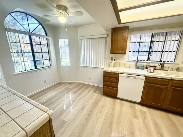 a kitchen with a sink cabinets and window