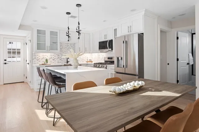 a large white bed in a white room