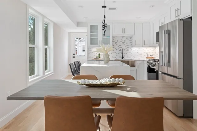 a bathroom with a sink toilet and mirror