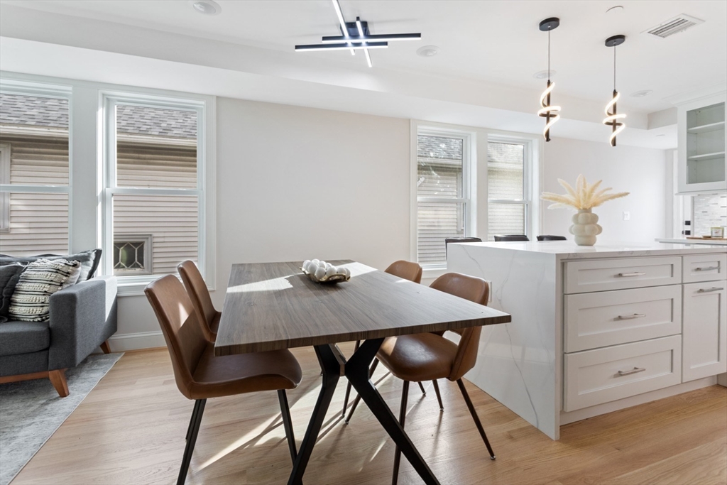 155 A Boston Avenue, Unit 2 Somerville, MA 02144 - Photo 15 of 38 a view of a dining room with furniture and window