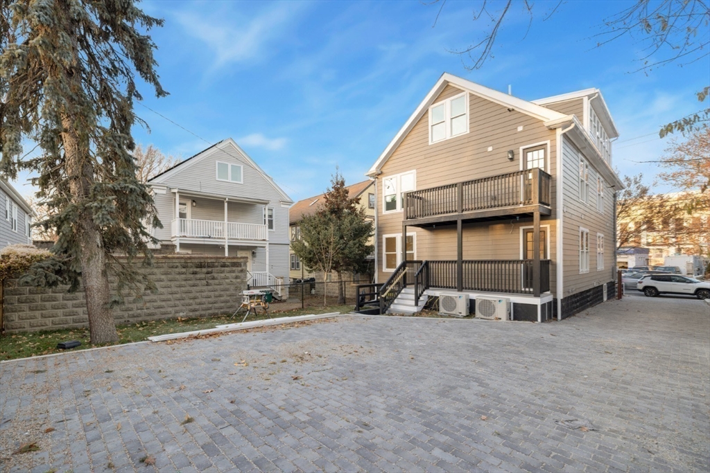 155 A Boston Avenue, Unit 2 Somerville, MA 02144 - Photo 31 of 38 a view of a house with a yard