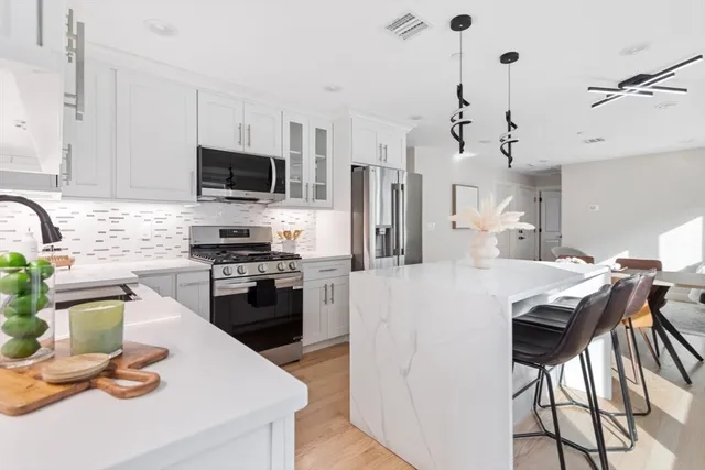 a view of a dining room with furniture and window