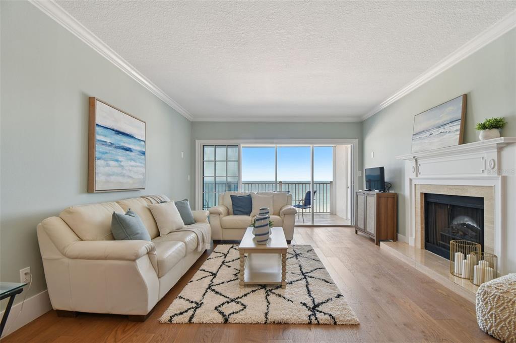 1586 Gulf Boulevard, Unit 2502 Clearwater Beach, FL 33767 - Photo 27 of 47 a living room with furniture fireplace and window