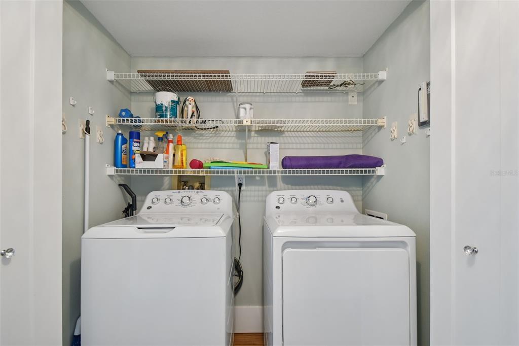 1586 Gulf Boulevard, Unit 2502 Clearwater Beach, FL 33767 - Photo 32 of 47 a utility room with dryer and washer
