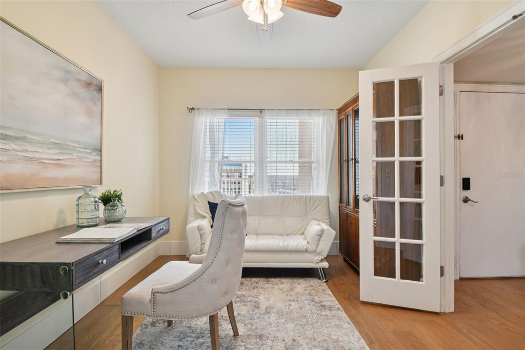 1586 Gulf Boulevard, Unit 2502 Clearwater Beach, FL 33767 - Photo 33 of 47 a living room with furniture and a window