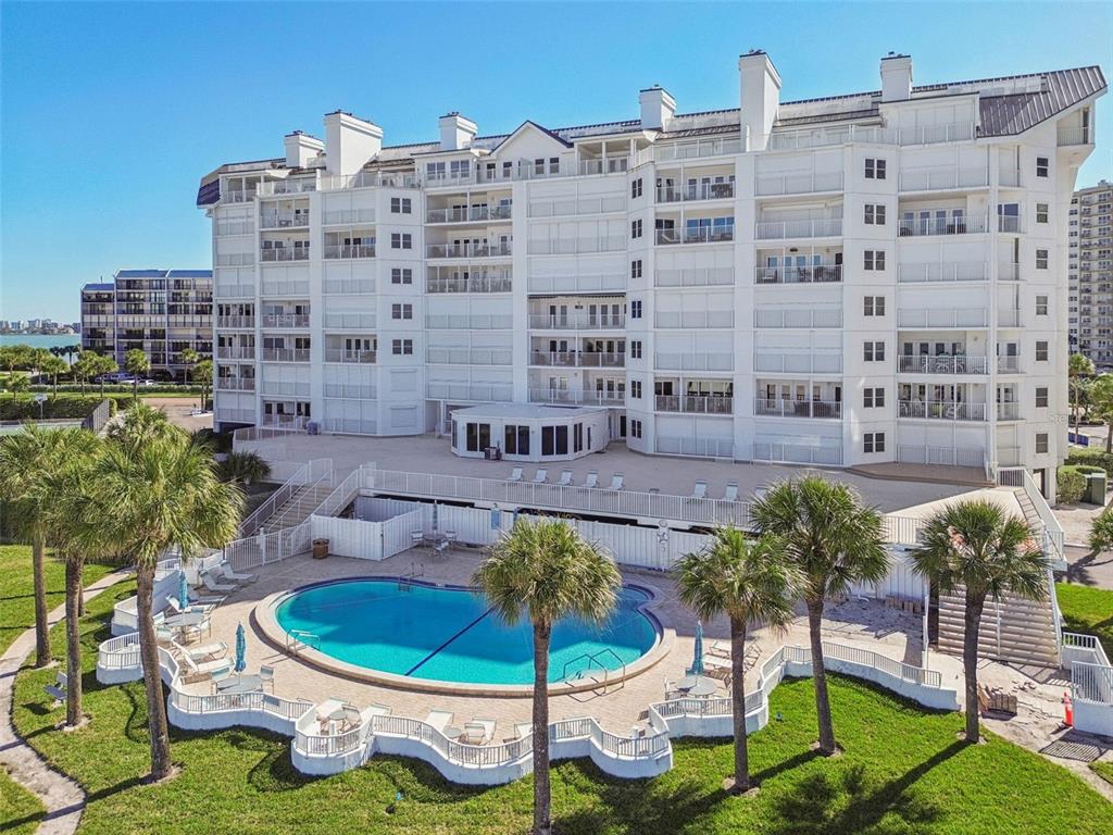 1586 Gulf Boulevard, Unit 2502 Clearwater Beach, FL 33767 - Photo 45 of 47 a view of a tall building and a yard