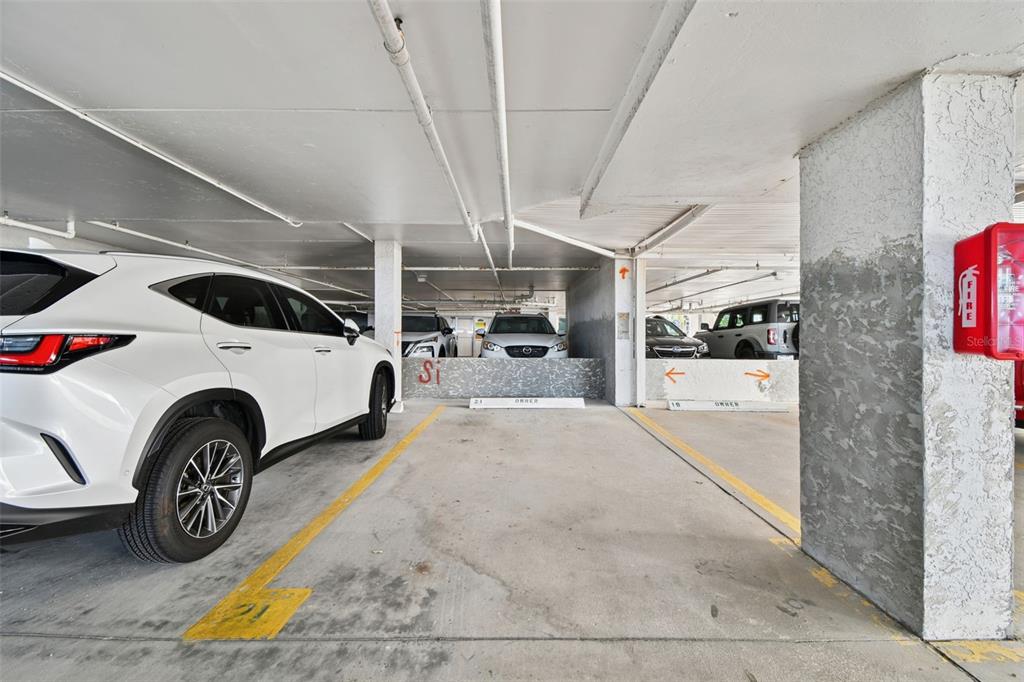 1586 Gulf Boulevard, Unit 2502 Clearwater Beach, FL 33767 - Photo 47 of 47 a utility room with dryer and cars
