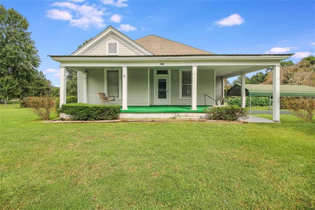 168 Church Road Hampton, GA 30228 - Photo 1 of 1 front view of a house with a garden