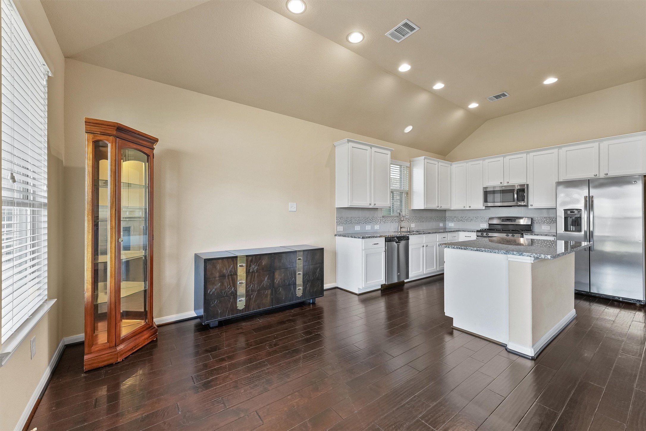 3841 Enchanted Timbers Lane Spring, TX 77386 - Photo 8 of 28 a kitchen with a refrigerator and a stove top oven