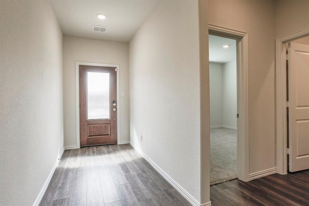 652 Ridgeback Trail Fort Worth, TX 76052 - Photo 3 of 20 Entryway with dark wood-type flooring