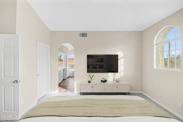 a view of a livingroom with a flat screen tv and a couch