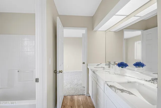 a bathroom with a sink and a mirror