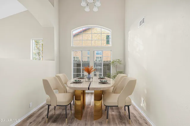 a view of a dining room with furniture window and outside view