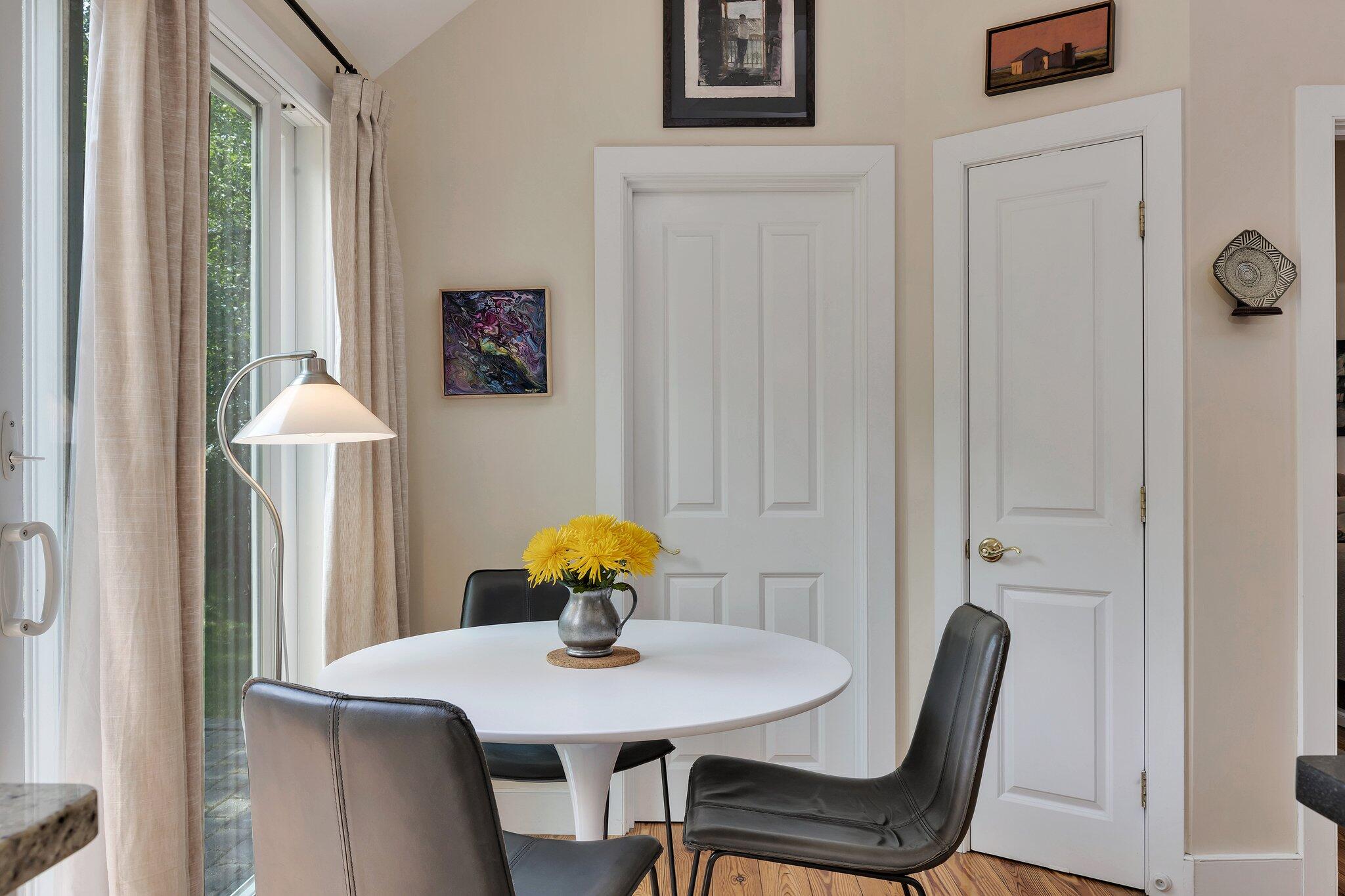 6 Shore Road, Unit 10 Truro, MA 02666 - Photo 13 of 37 a view of a dining room with furniture and wooden floor