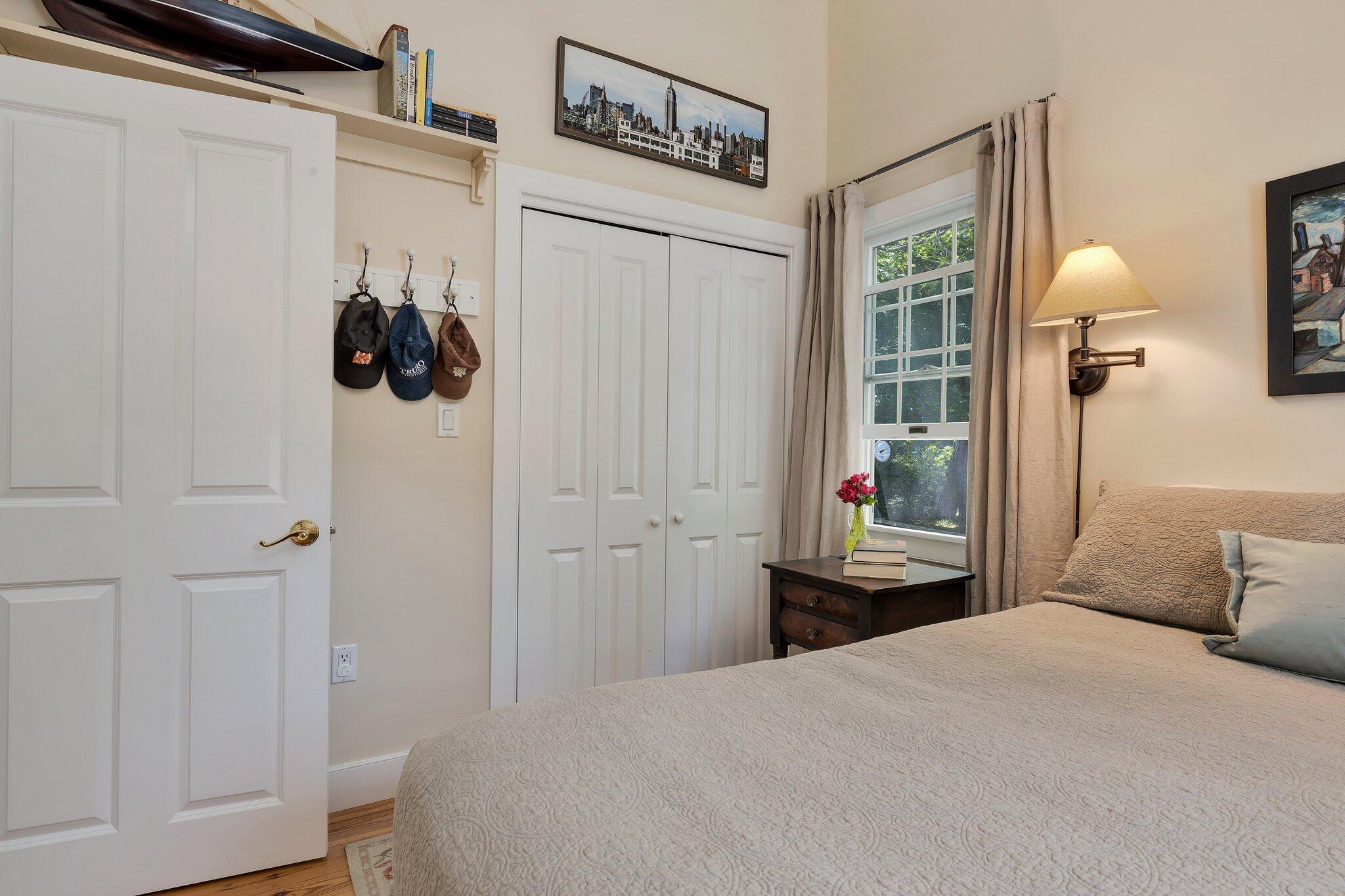6 Shore Road, Unit 10 Truro, MA 02666 - Photo 15 of 37 a bedroom with a bed and a window
