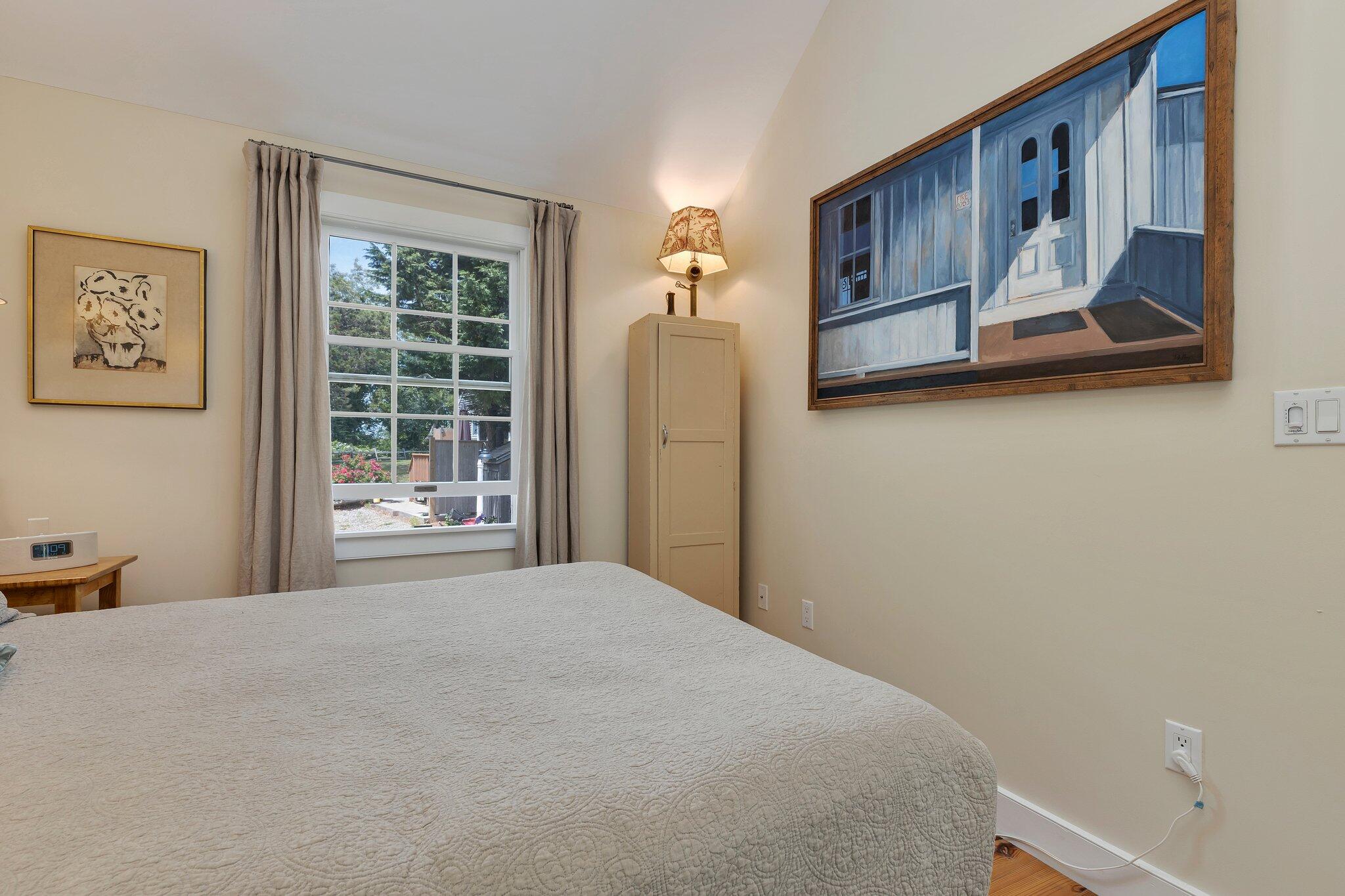 6 Shore Road, Unit 10 Truro, MA 02666 - Photo 16 of 37 a bedroom with a bed and a window