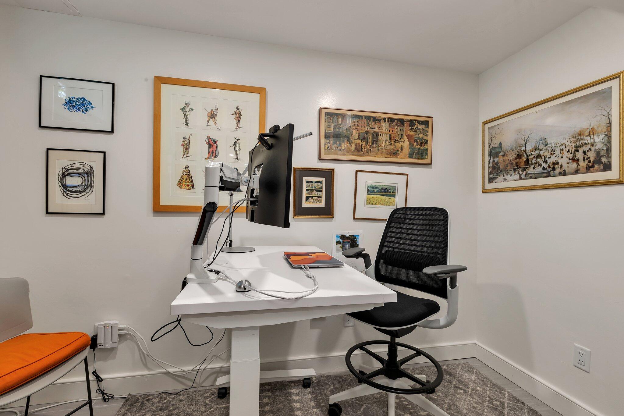6 Shore Road, Unit 10 Truro, MA 02666 - Photo 20 of 37 a workspace with furniture and painting on the wall