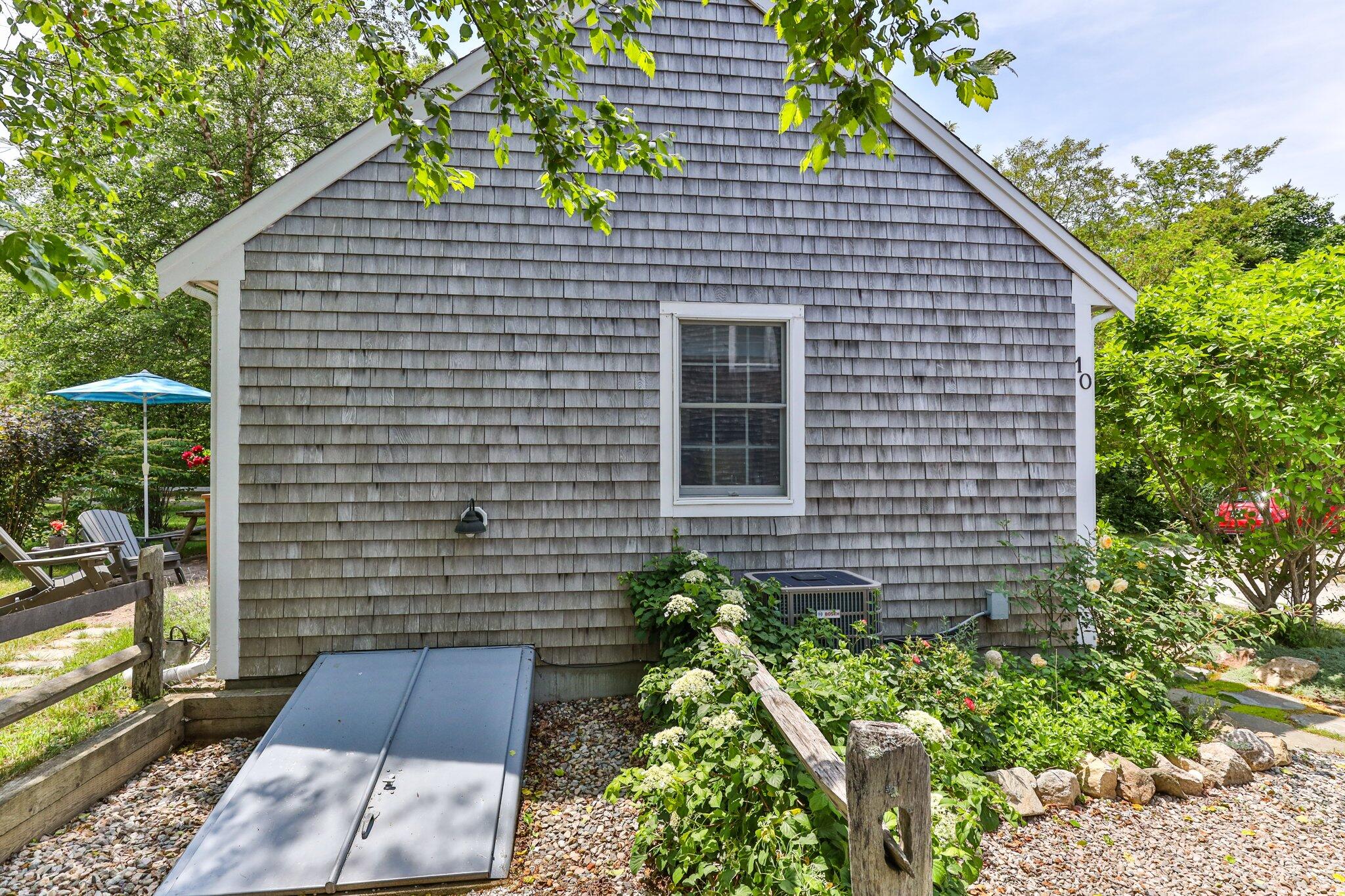 6 Shore Road, Unit 10 Truro, MA 02666 - Photo 23 of 37 a view of house with backyard