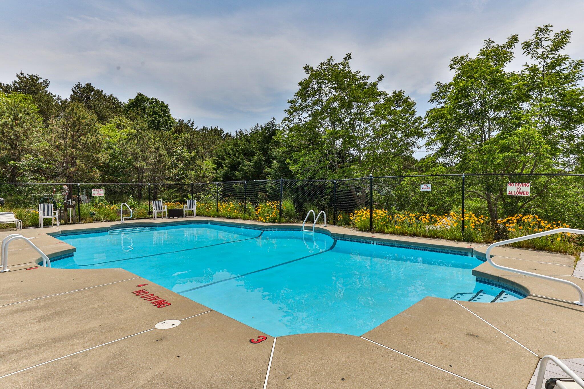 6 Shore Road, Unit 10 Truro, MA 02666 - Photo 34 of 37 a view of a swimming pool and lounge chairs