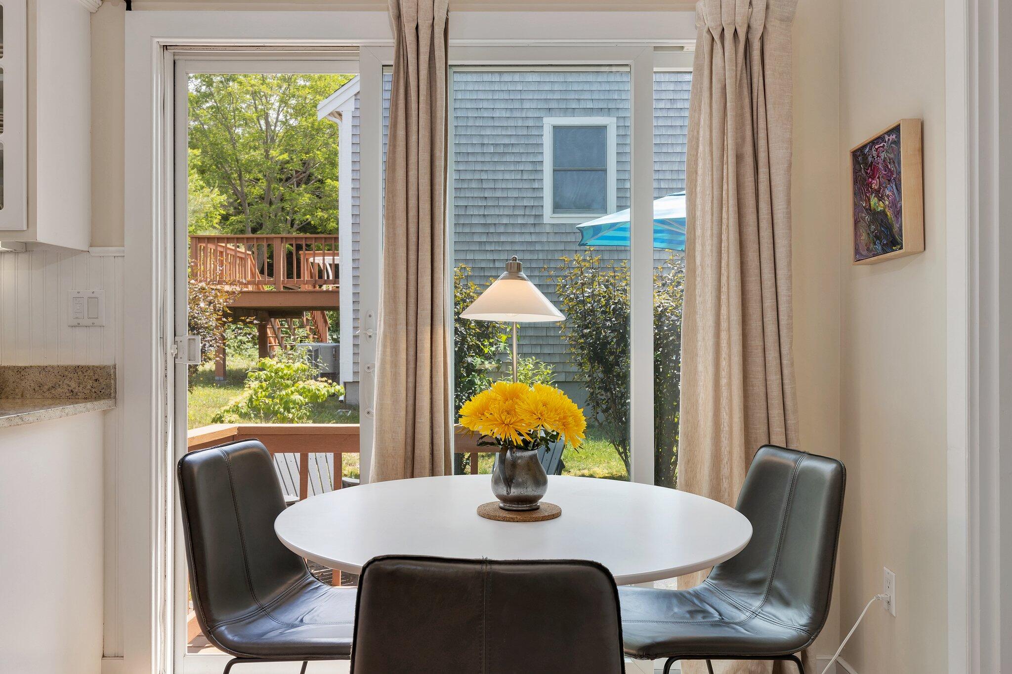 6 Shore Road, Unit 10 Truro, MA 02666 - Photo 9 of 37 a dining room with furniture and window