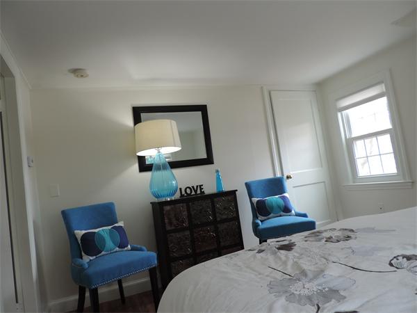 169 Islington Road Newton, MA 02466 - Photo 12 of 16 a bedroom with a bed window and chair