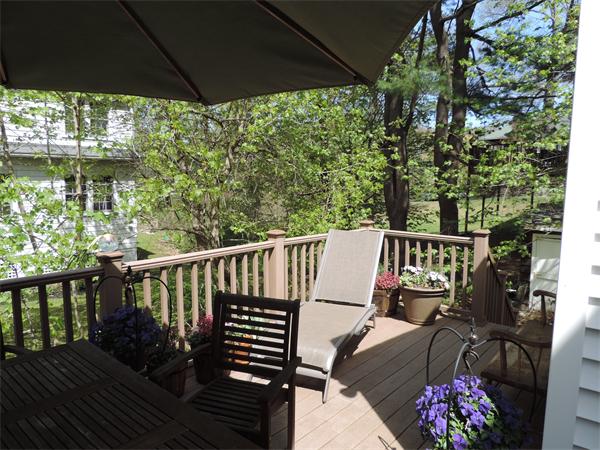 169 Islington Road Newton, MA 02466 - Photo 15 of 16 a balcony with wooden floor and outdoor seating