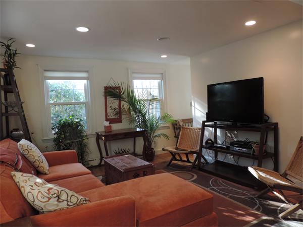 169 Islington Road Newton, MA 02466 - Photo 5 of 16 a living room with furniture and a flat screen tv