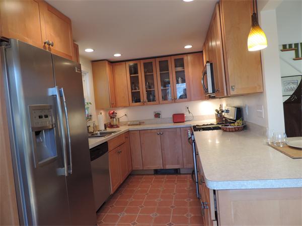 169 Islington Road Newton, MA 02466 - Photo 6 of 16 a kitchen with stainless steel appliances granite countertop a refrigerator a sink and a stove