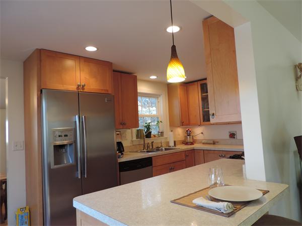 169 Islington Road Newton, MA 02466 - Photo 7 of 16 a kitchen with a sink and refrigerator