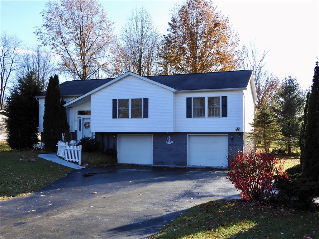 407 Oneida Trail Mercer, PA 16137 - Photo 1 of 25 a view of a house with a yard plants and large tree