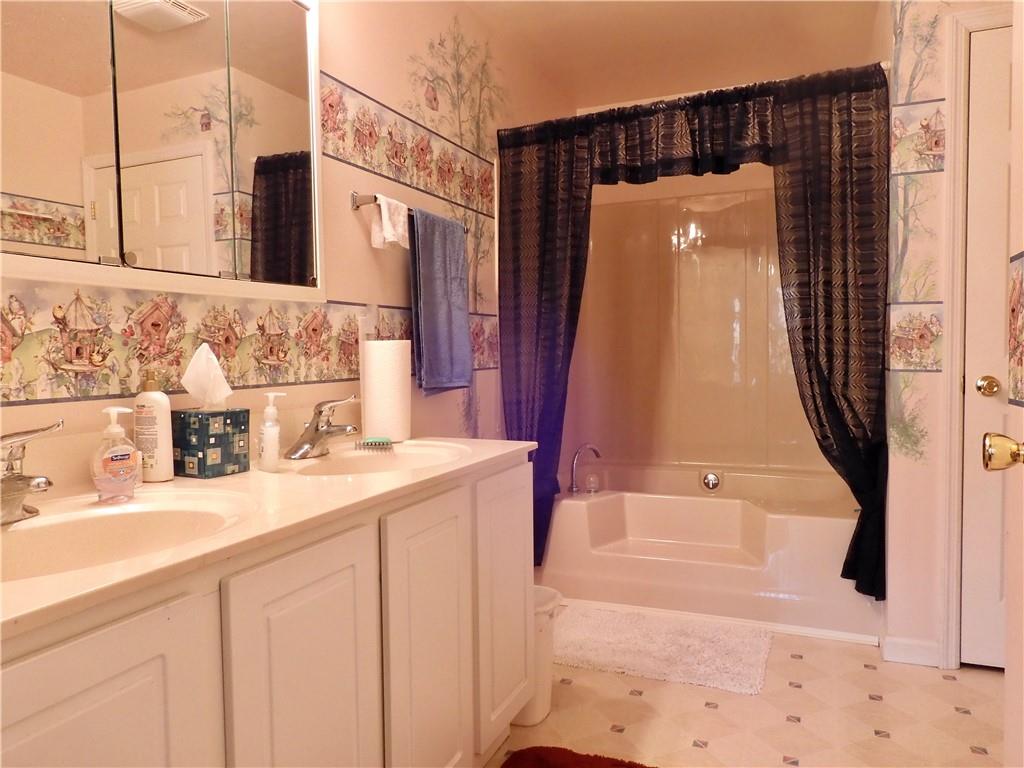 407 Oneida Trail Mercer, PA 16137 - Photo 13 of 25 a bathroom with a sink and a mirror