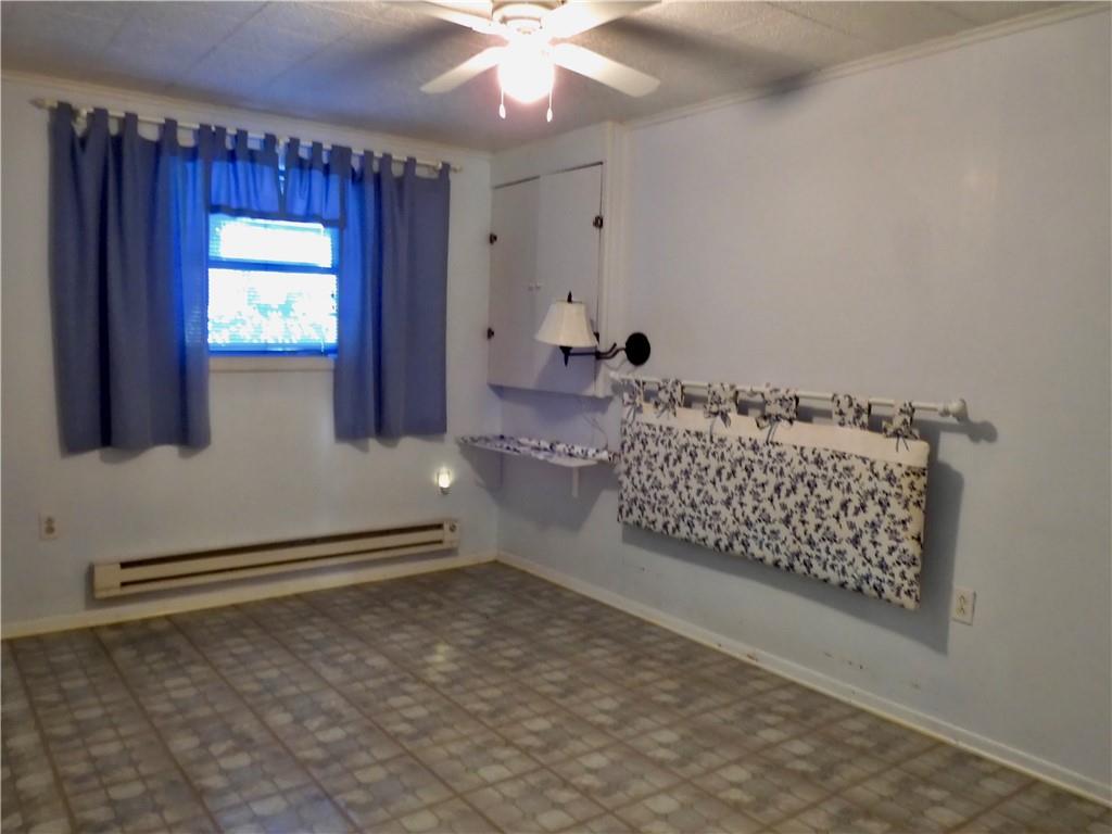 407 Oneida Trail Mercer, PA 16137 - Photo 17 of 25 wooden floor in an empty room with a window