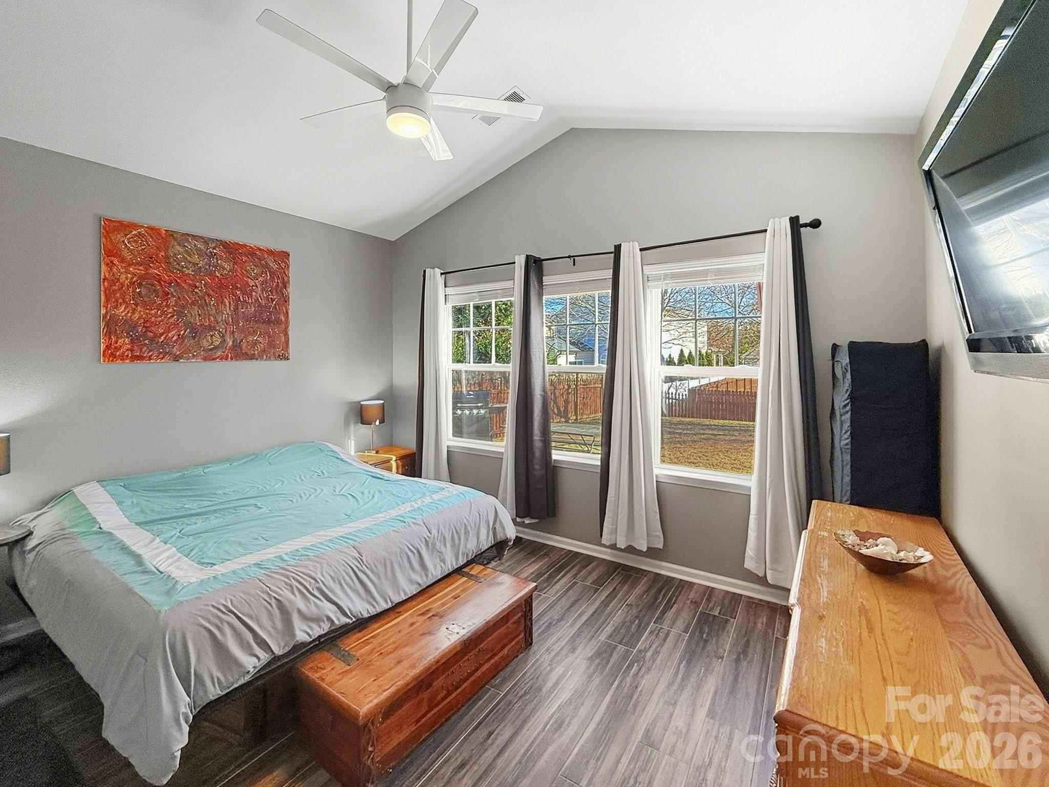 179 Whitley Mills Road, Unit 44 Fort Mill, SC 29708 - Photo 11 of 25 a bedroom with bed and wooden floor