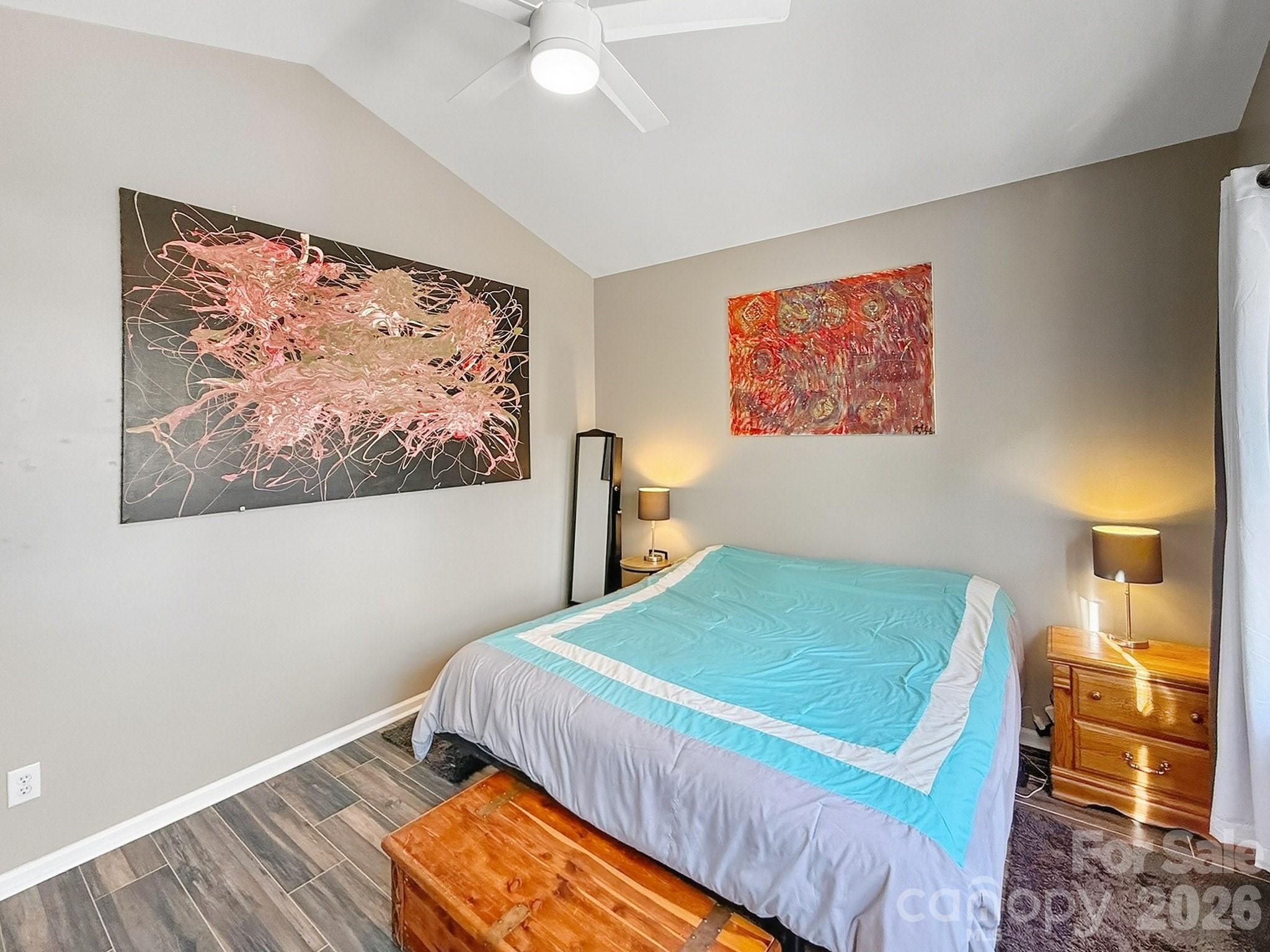 179 Whitley Mills Road, Unit 44 Fort Mill, SC 29708 - Photo 12 of 25 a bedroom with a bed and a painting on the wall