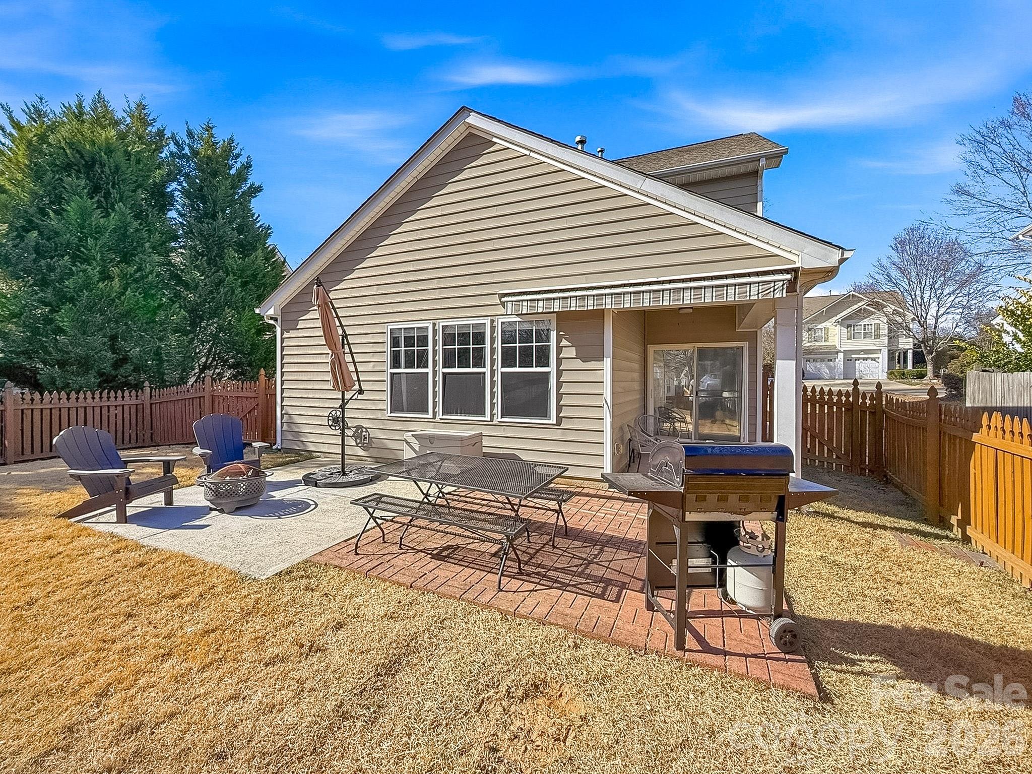 179 Whitley Mills Road, Unit 44 Fort Mill, SC 29708 - Photo 24 of 25 a view of a dinning table and chairs in the patio