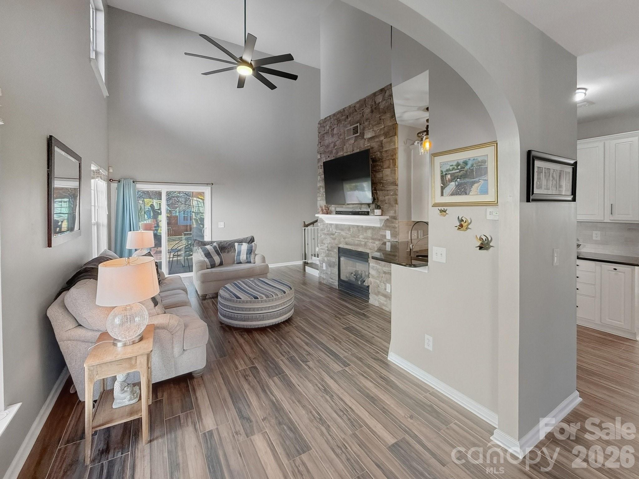 179 Whitley Mills Road, Unit 44 Fort Mill, SC 29708 - Photo 4 of 25 a living room with furniture a flat screen tv and kitchen view