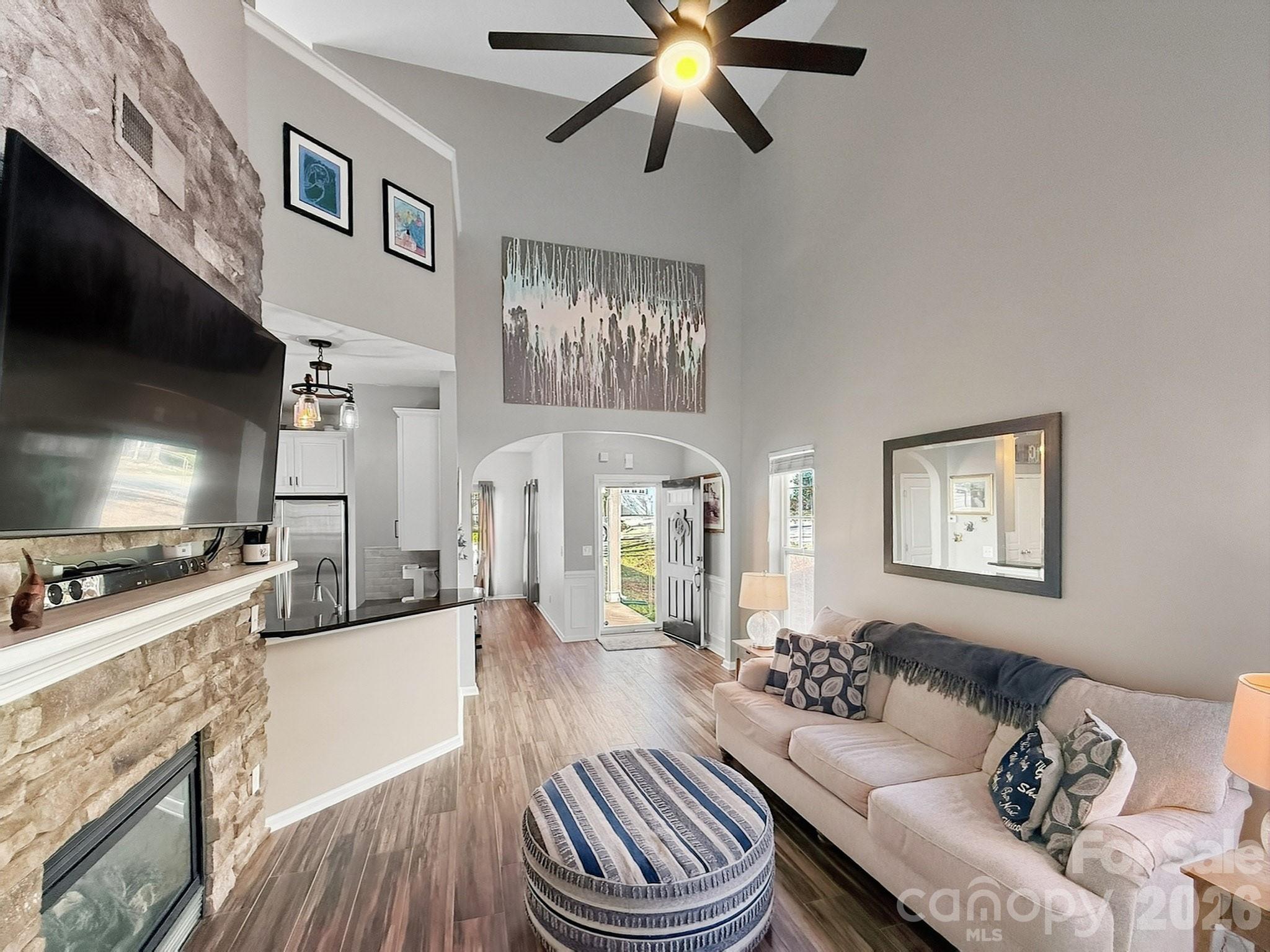 179 Whitley Mills Road, Unit 44 Fort Mill, SC 29708 - Photo 6 of 25 a living room with furniture a fireplace and a flat screen tv