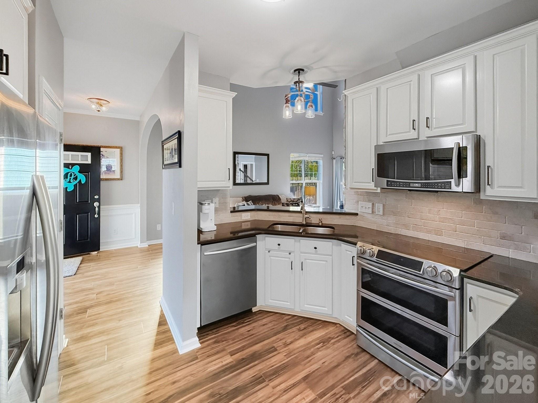 179 Whitley Mills Road, Unit 44 Fort Mill, SC 29708 - Photo 10 of 25 a kitchen with granite countertop a stove and a sink