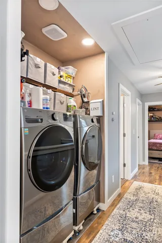 a utility room with sink dryer and washer