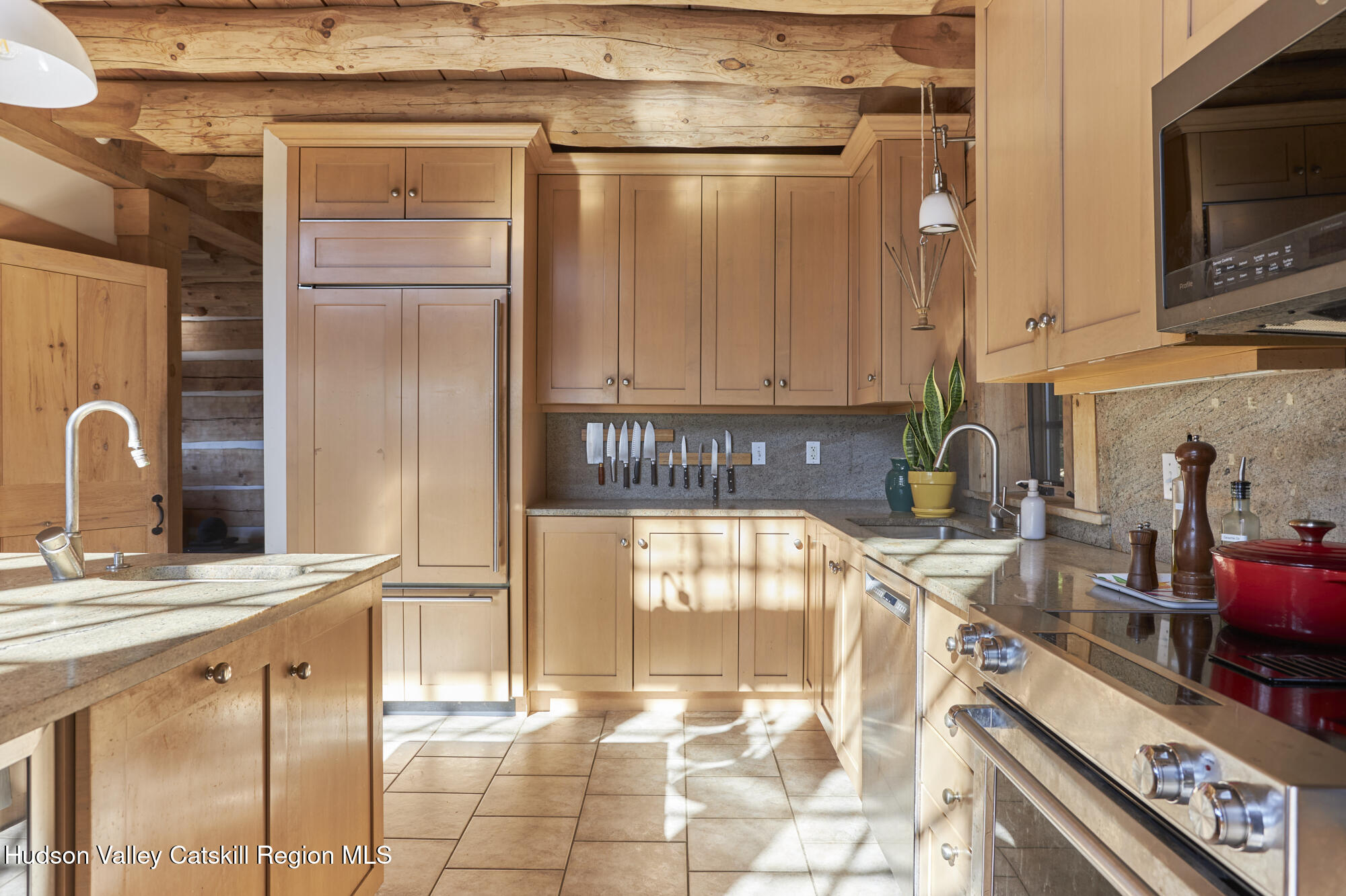 87 Kaye Road Millerton, NY 12546 - Photo 12 of 46 a kitchen with granite countertop a refrigerator and a stove top oven
