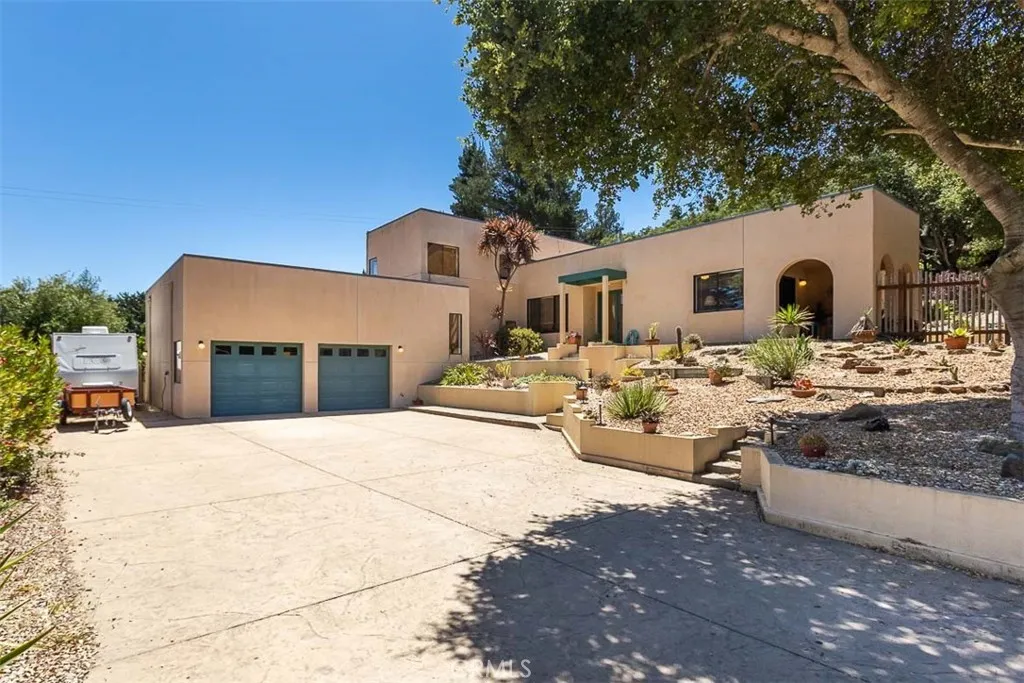 a view of a house with snow on the background